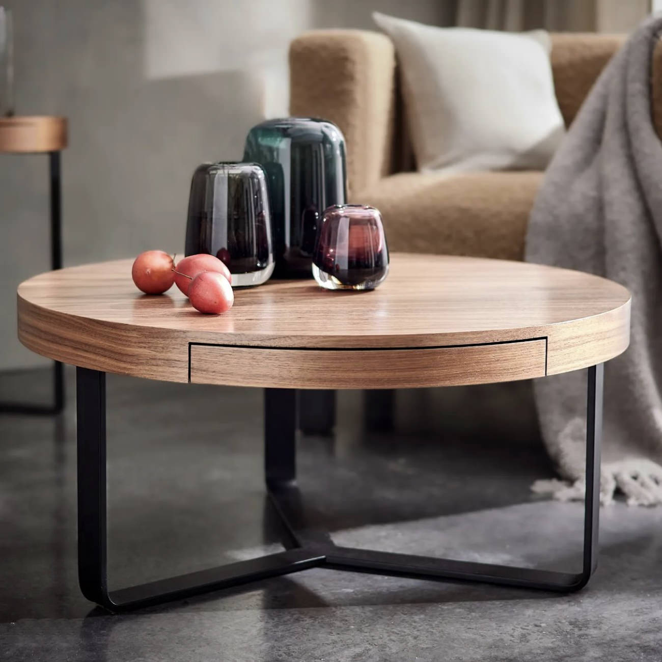 Round designer coffee table in walnut